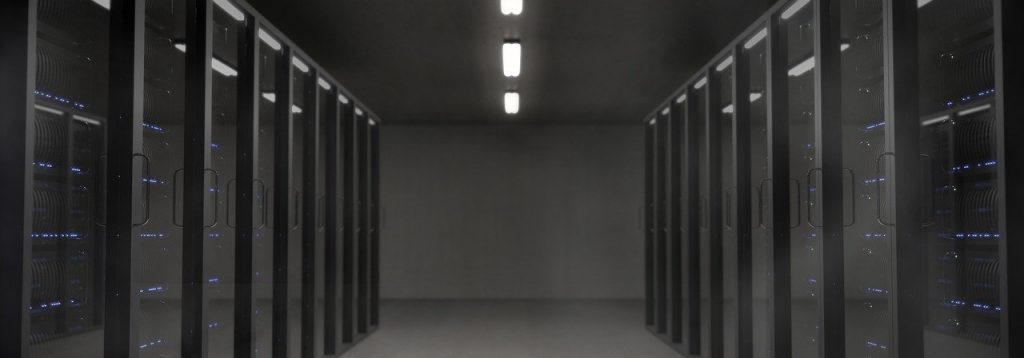 rows of servers in a dark room